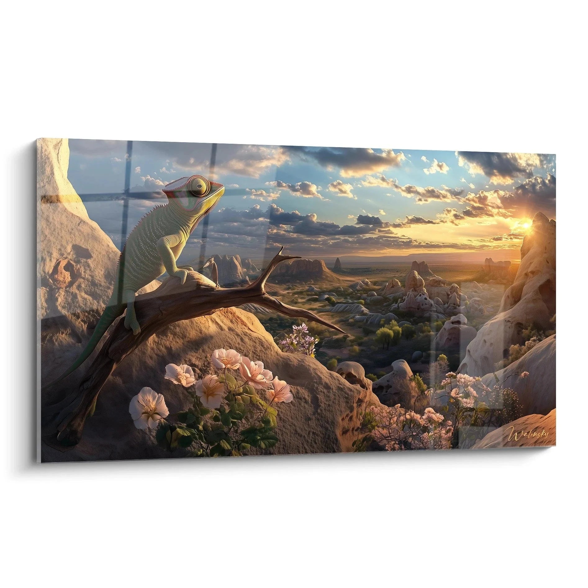 Wandbild Chamäleon auf Felsen in Wüstenlandschaft mit spektakulärem Sonnenuntergang und Blüten