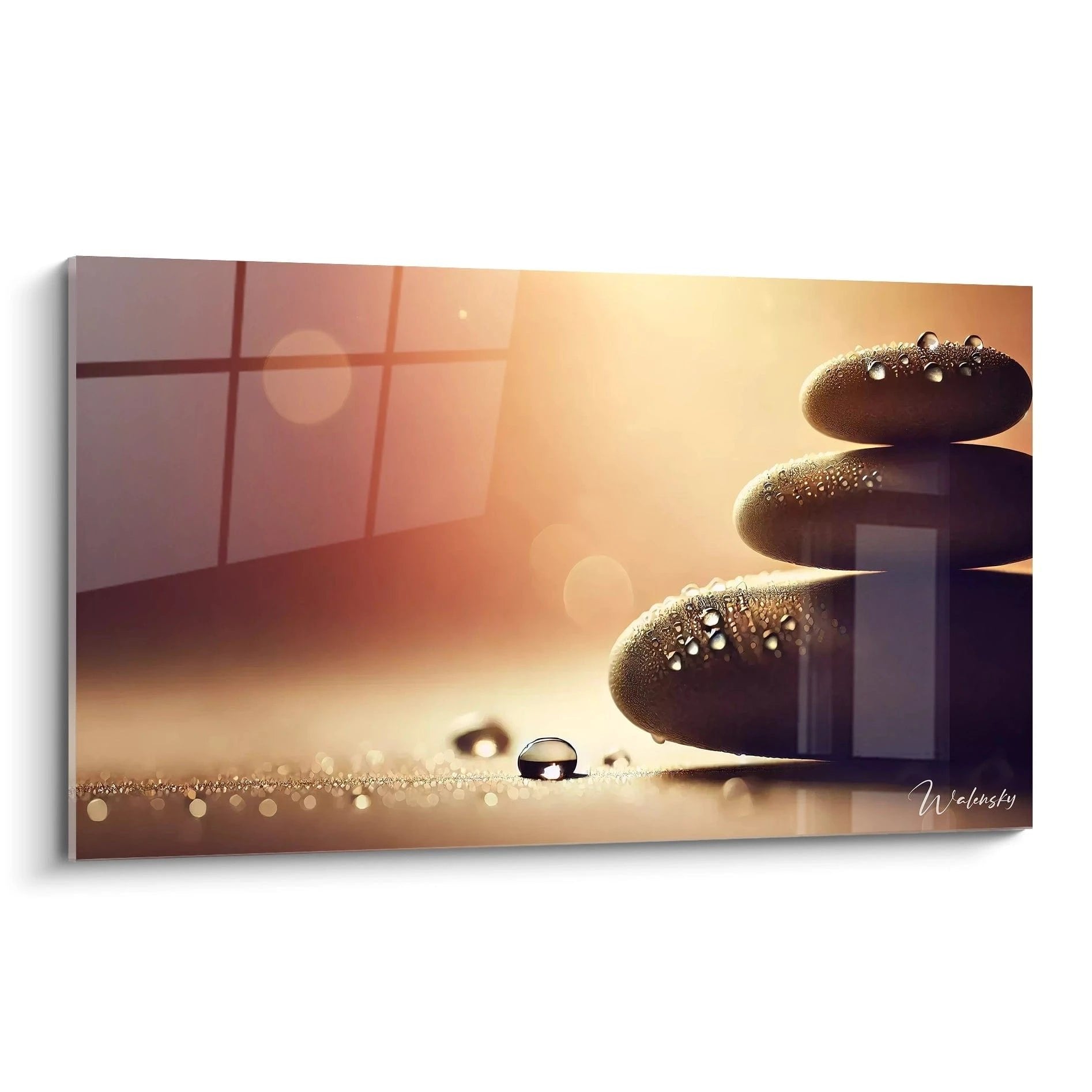 Gestapelte Zen-Steine mit Wassertropfen in warmem goldenem Licht für Meditation und Entspannung