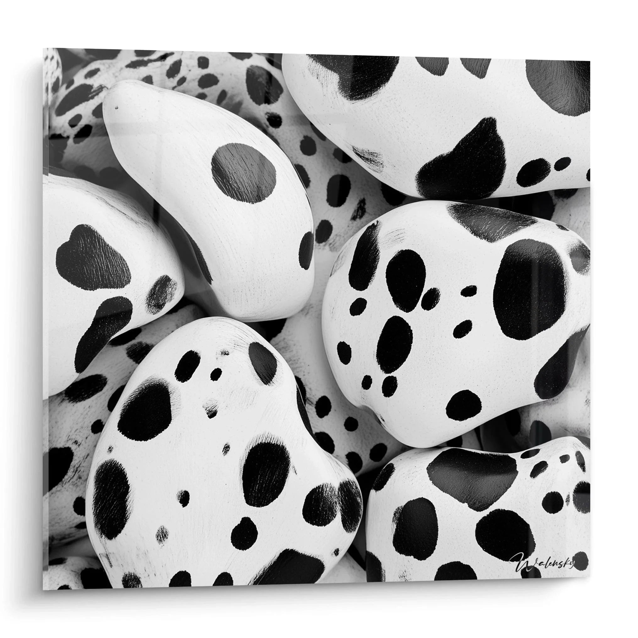 Wandbild gepunktete Kieselsteine in Dalmatiner-Optik schwarz-weiß für moderne Wanddekoration