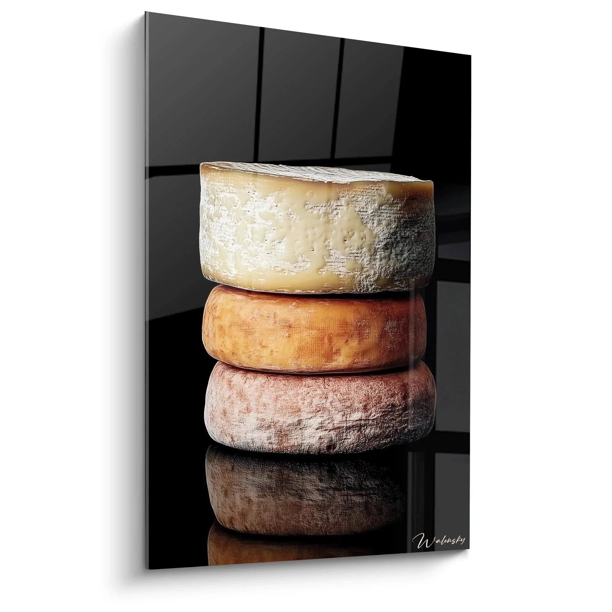 Wandbild gestapelte Käselaibe - Vier verschiedene Käsesorten übereinander gestapelt auf schwarzem Hintergrund