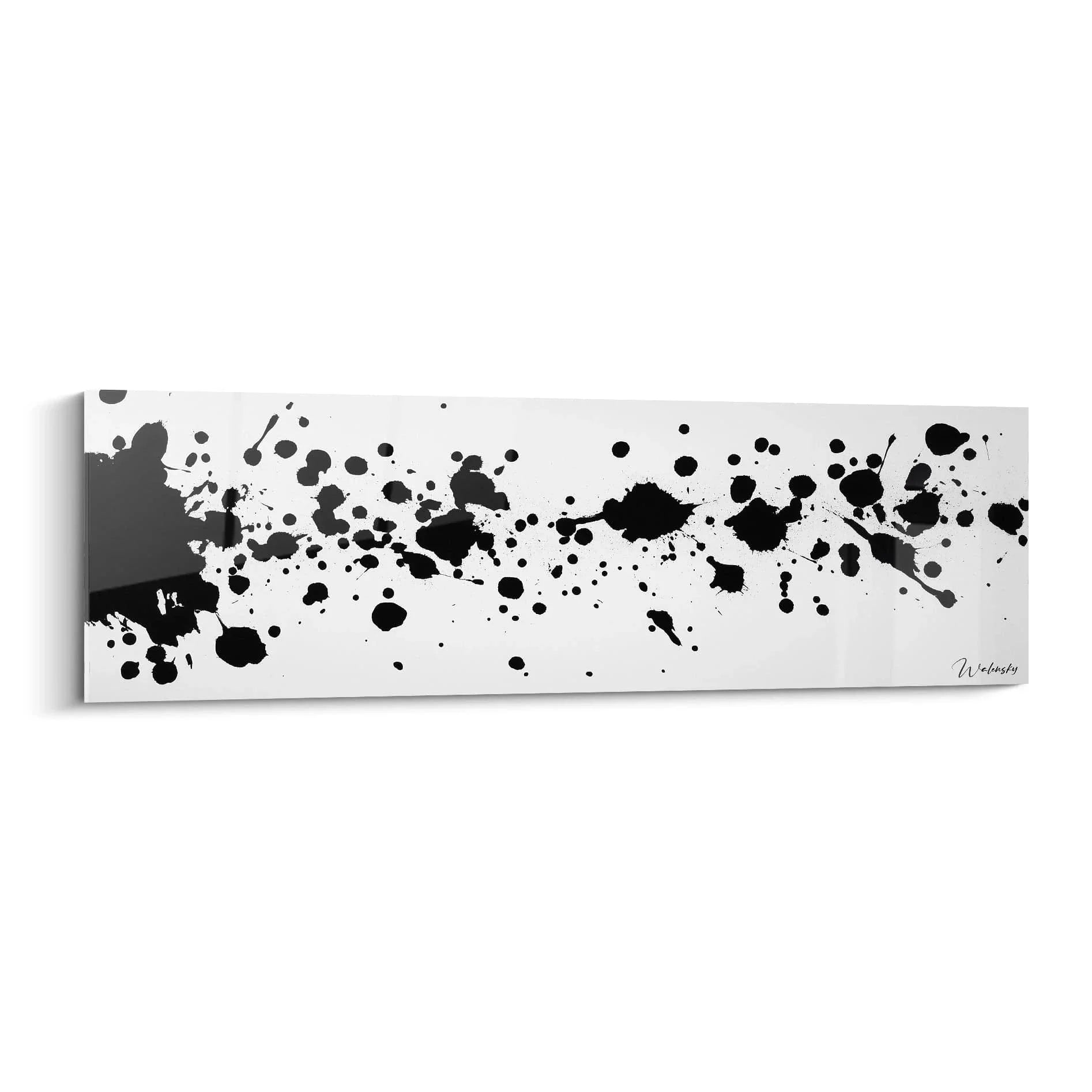 Abstraktes Wandbild mit schwarzen Tintenspritzern auf weißem Grund in Dalmatiner-Optik